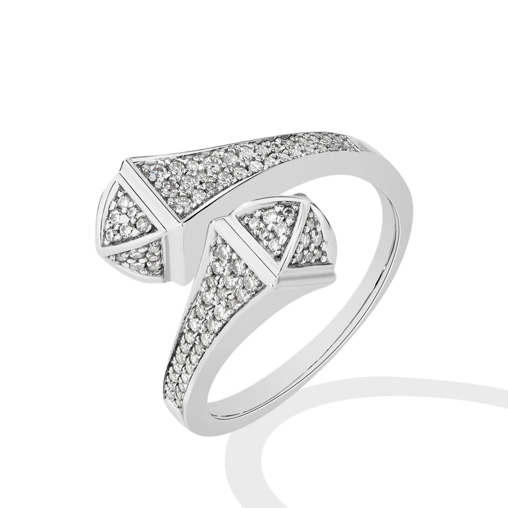 Silver ring with diamond accents on a white background.