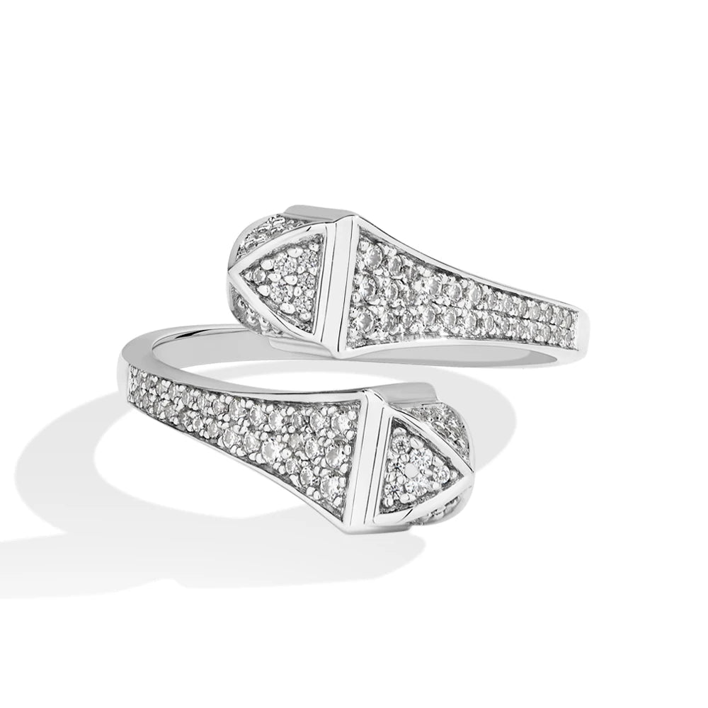 Silver ring with diamond accents on a white background.